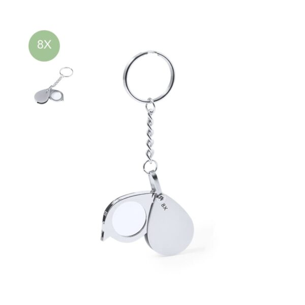 Metal keychain with a folding magnifying glass marked 8X.