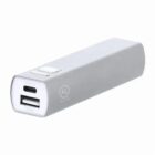 Silver rectangular portable power bank with USB and micro USB ports.