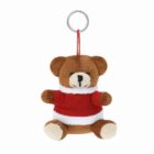 Plush teddy bear keychain wearing a red and white sweater on a white background.