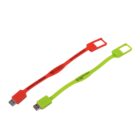 Two flat, rectangular silicone USB bracelets; one red, one green, on a white background.