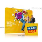 Bright flash sale display with colorful graphics, a woman, and a man beside a sale counter.