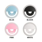 Four circular selfie lights in blue, black, pink, and white.