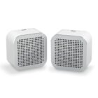 Two white rectangular wireless speakers with mesh fronts.