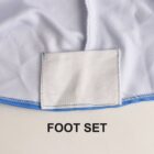 Close-up of a fabric patch labeled FOOT SET on a white and blue garment edge.
