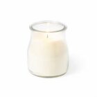 A lit white candle in a clear glass jar against a plain white background.