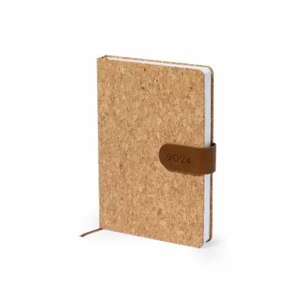 A cork-textured notebook with a brown strap labeled 2024. It has cream-colored pages and a ribbon bookmark. The notebook is standing at a slight angle, displaying its cover and binding.