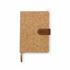 A cork-covered notebook with a brown leather strap embossed with 2024 on the right side. A matching brown ribbon bookmark extends from the bottom. The notebook is set against a plain white background.