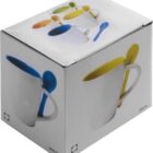 Box showing white mugs each with a colorful spoon in the handle; mugs in blue, green, and yellow.