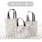 Three marble-patterned tote bags in small, medium, and large sizes on a tiled surface.