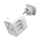 White universal travel adapter with various plugs and sockets on a white background.