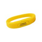 Yellow bracelet with Teaching and Learning Forum text on it.