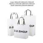 Three white shopping bags with black text and handles, labeled large, medium, and small.