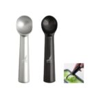 Silver and black ice cream scoops with a small image showing one scooping green ice cream.
