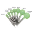 Set of green and silver measuring spoons labeled with capacities in a fan layout.