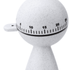 White egg-shaped kitchen timer with a speckled design and marked black numerals.