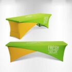 Green and yellow promotional table covers with sales and delivery text.