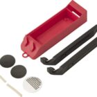 Bicycle tire repair kit with tire levers, patches, and a red case.