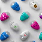 Capsules with popular brand logos on a white background in a diagonal arrangement.
