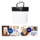 A white and black tote bag with customizable packaging options displayed below.