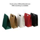 Five gift bags in green, brown, white, red, and black with handle cutouts.