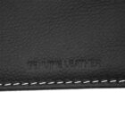 Close-up of textured black leather with white stitching and Genuine Leather embossed.