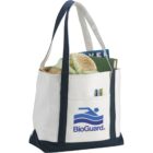Canvas tote bag filled with a book, towels, and pens.