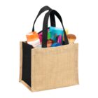A tote bag filled with various colorful cosmetics and personal care items.