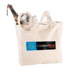 Canvas tote bag with a newspaper and rolled umbrella inside.