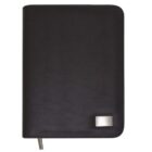 Black leather binder with a silver label on the bottom right corner.