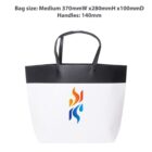 Black and white tote bag with multicolored flame design and size details above.