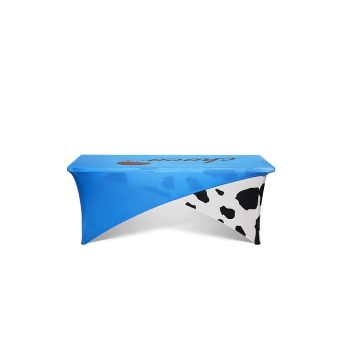 Blue table cover with cow print accents on white background.