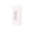 White gift bag labeled Air Mail standing upright.