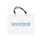 White shopping bag with Ben Betesh in blue and pink text. Black handles on top.