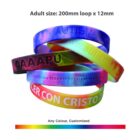 Colorful customized wristbands with text, displayed in a stack.