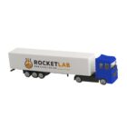Toy truck with RocketLab logo on white trailer and blue cab.