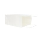 White paper shopping bag on its side with handles visible.