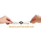 Hands pulling both ends of a retractable cable with an arrow diagram.