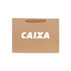 Brown paper bag with CAIXA printed in bold white letters.