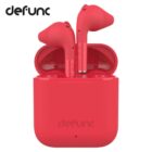 Red Defunc wireless earbuds in an open charging case, showing both earbuds upright.