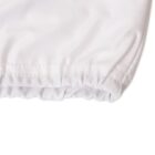 Close-up of a white fabric with elastic seen at the edges.