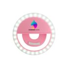 Round pink selfie ring light with LED bulbs and a clip, featuring a colorful logo.