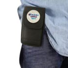 Person wearing jeans and shirt with a pouch displaying Kindness Works Here.