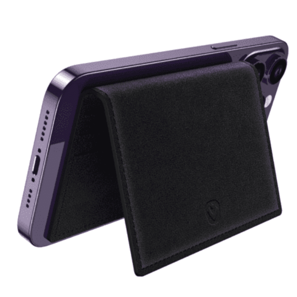 A black wallet-style phone stand attached to the back of a purple smartphone.