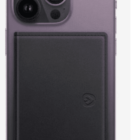 A smartphone with a black wallet case attached to the back.