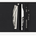 Open black wallet with cash and cards visible in the pockets.