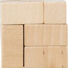 Stacked wooden blocks forming a small cube pattern.