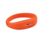 Orange silicone wristband with TAFE Western logo in black and white.
