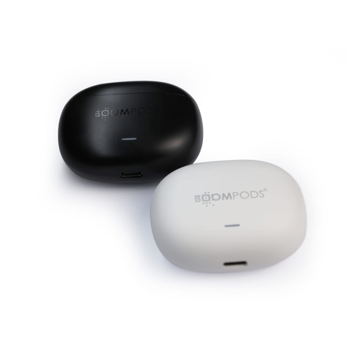 Two wireless earbud cases on a white background. One case is black and the other is white, both labeled Boompods. Each has an LED indicator light.