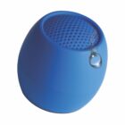 A blue, egg-shaped portable speaker with a droplet of water on it.