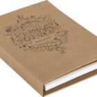 Brown hardcover notebook with decorative design and blank white pages.